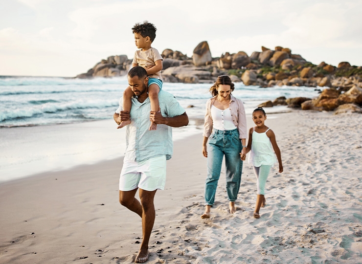 Family walking along the beach